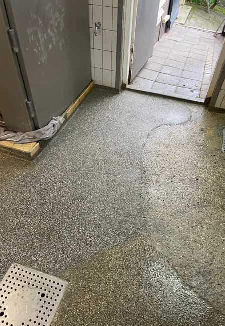 Repareren van een betonvloer