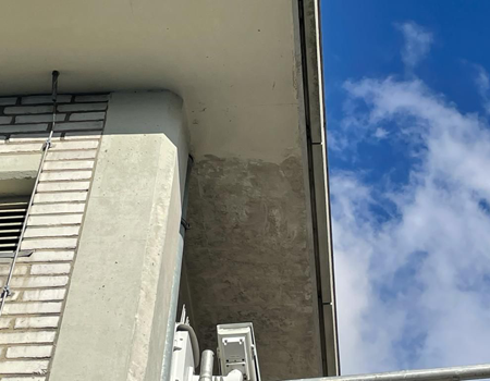 Schuren van betongevels en buitenmuren